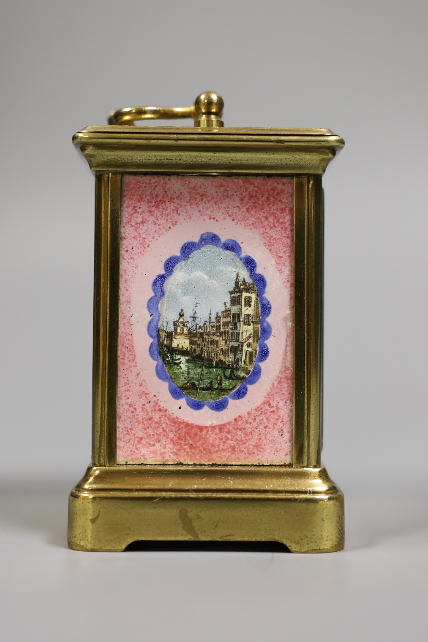 A miniature carriage timepiece, with enamelled side panels of Venice, 8 cms high